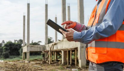 Male construction contractor engineer checks structure